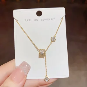 RENSINO Light Luxury Niche Design High-end Feeling Small Waist Four-leaf Flower Zircon Necklace Tassel Sweet Elegant Fashion All-match